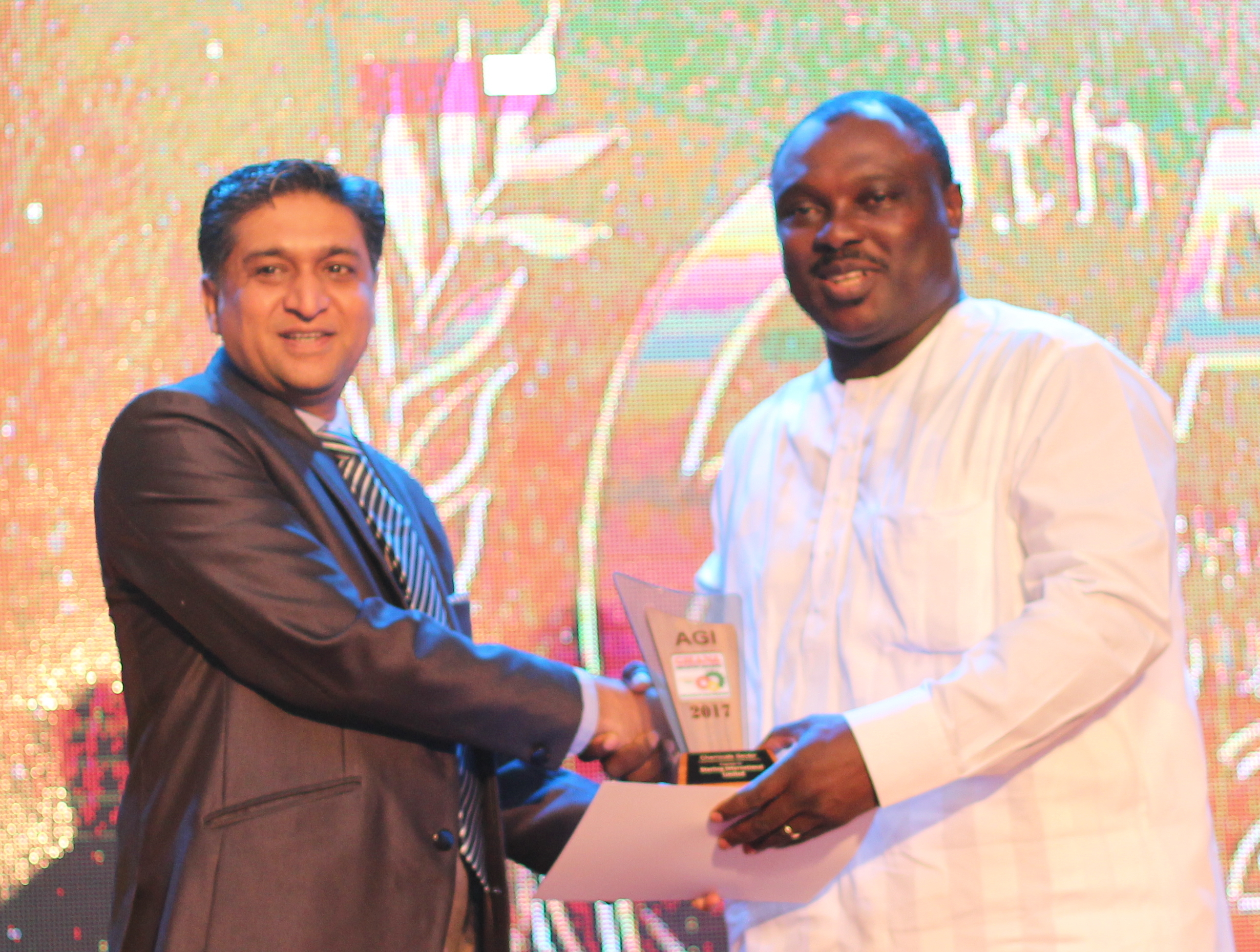 Mr Arun Patil, Managing Director of Sterling International, receiving the award from Mr Robert Ahomka Lindsey (right), the Deputy Minister of Trade and Industry